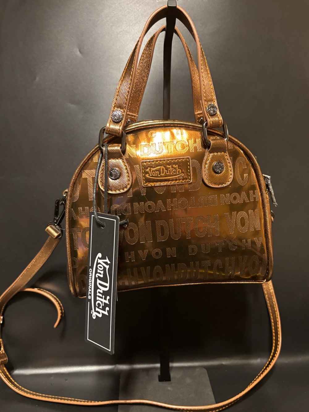 Von Dutch Metallic Bronze Mini Bowling Bag
Embossed Monogram Satchel Crossbody